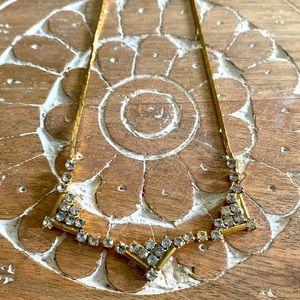 Gold and CZ necklace.